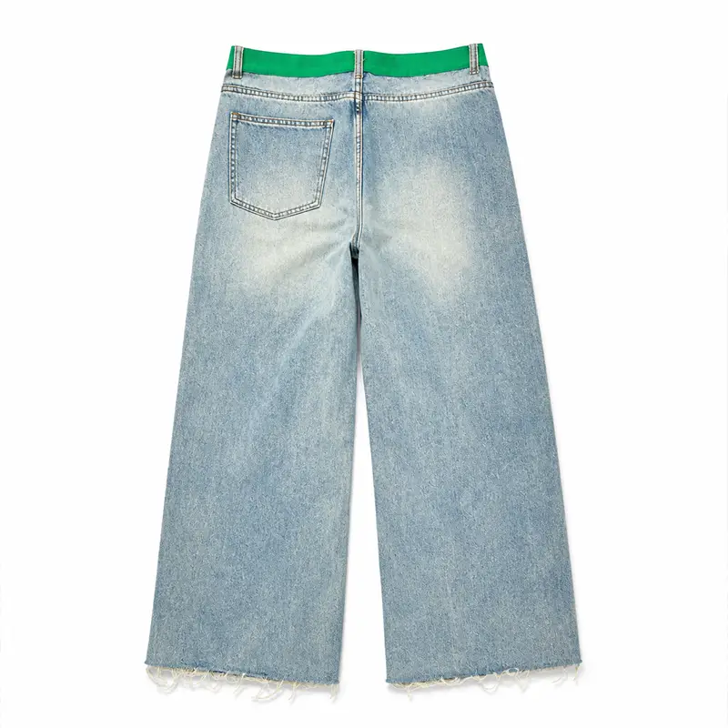 Back view of custom wide leg jeans with green waistband and light wash denim fabric