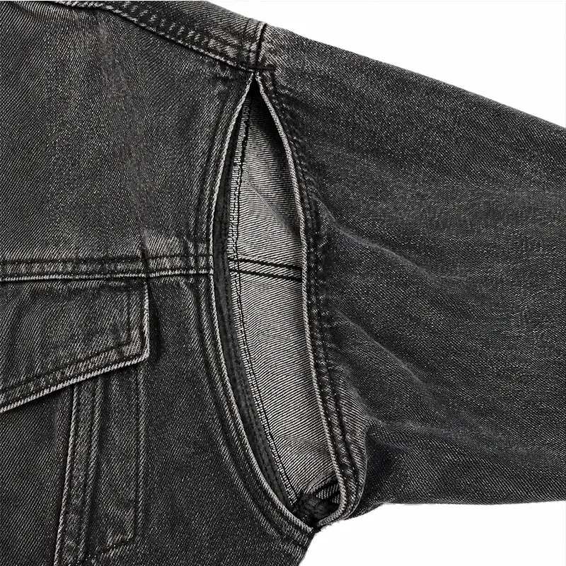 Armhole cutout detail on custom black denim jacket OEM