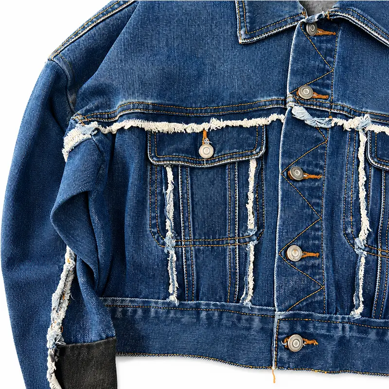 Front detail of frayed seam cropped denim jacket showing exposed raw edges wholesale