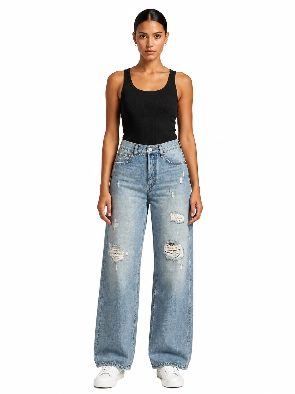 Custom distressed wide leg jeans with light wash denim and ripped knee details