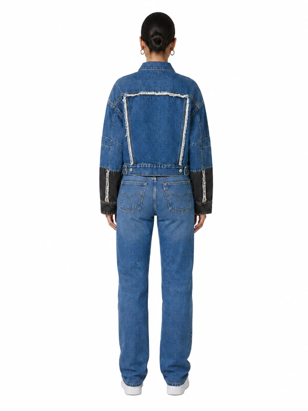 Back view of custom cropped denim jacket with exposed frayed seams and color block sleeves OEM