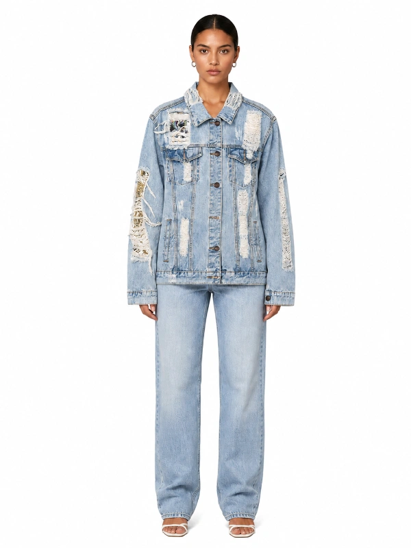 Front view of heavy distressed light blue denim jacket with sequin patches on model wholesale manufacturer