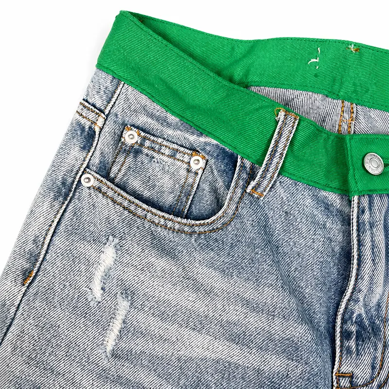 Light wash custom wide leg jeans with distressed pocket detail