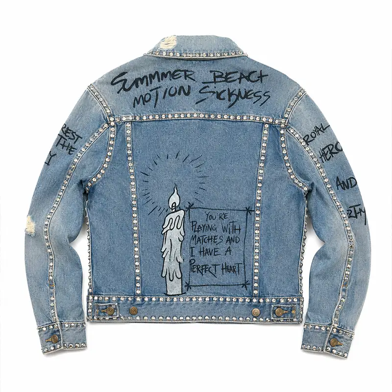 Custom graffiti denim jacket back design with allover studding details
