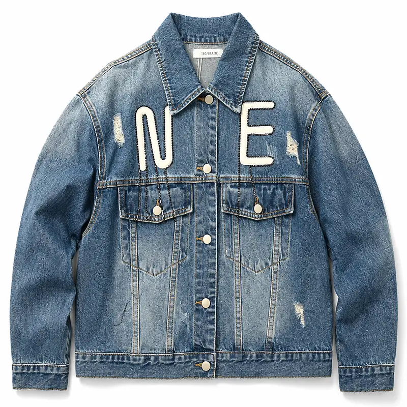 Distressed light-blue denim jacket with large white embroidered letter patches
