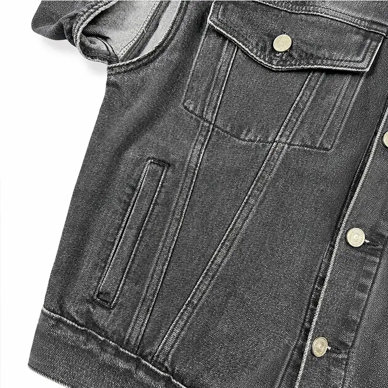 Front pocket and vintage wash details of cutout shoulder black denim jacket