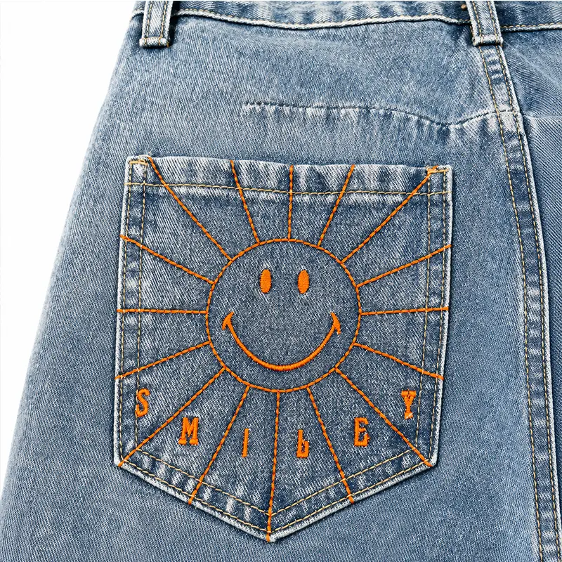 Smile face back pocket embroidery on custom light wash denim jeans for low MOQ production