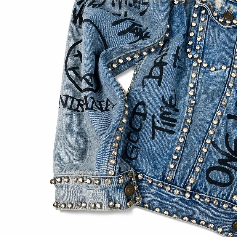Detailed graffiti pattern on custom studded denim jacket for streetwear brands