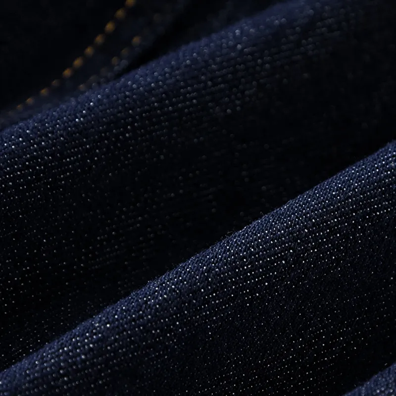 Close-up raw denim fabric texture and indigo yarn