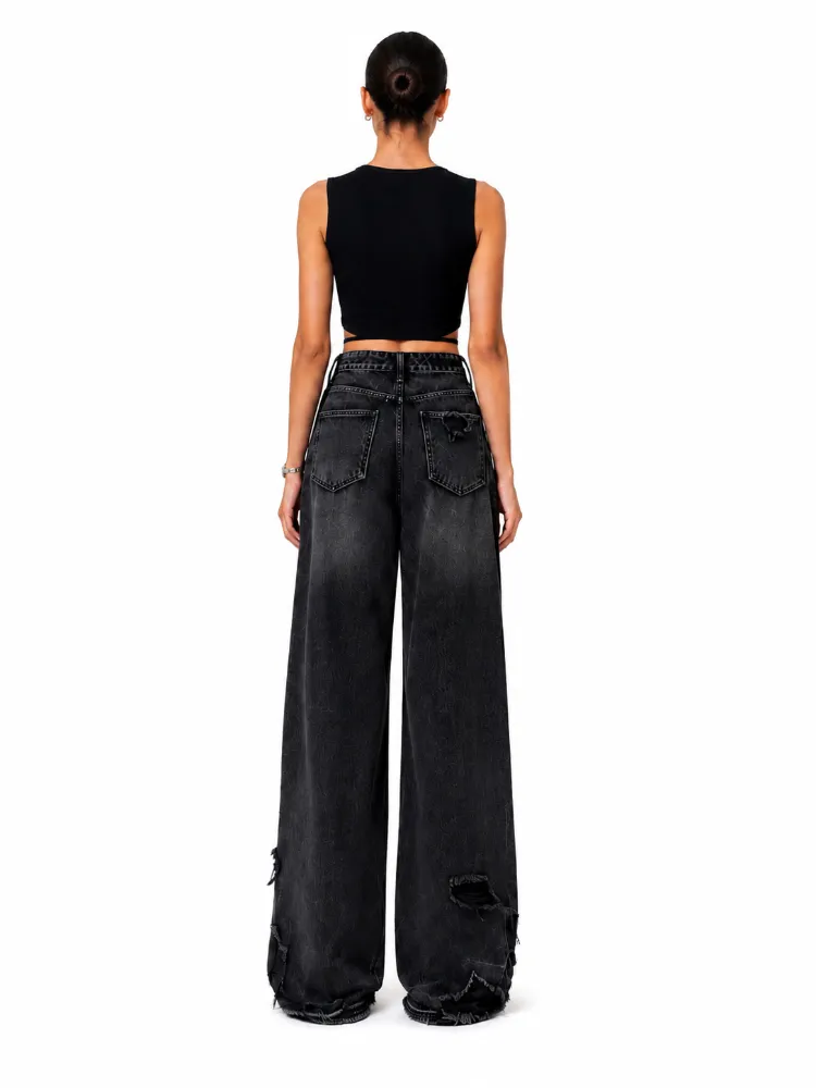 Custom black ripped wide-leg jeans, back view