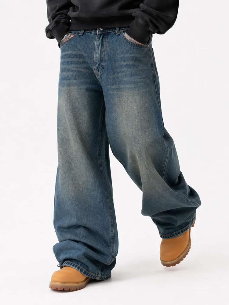 Model wearing dark wash baggy wide leg jeans