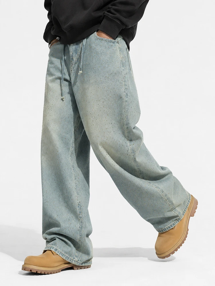 Model wearing light wash baggy wide leg jeans