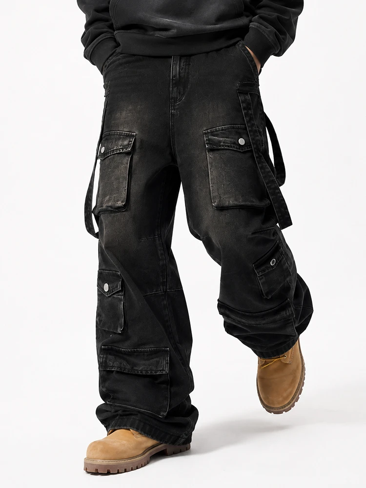 Front view of black cargo denim jeans with utility pockets